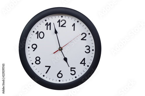 Time concept with black clock at five to five am or pm