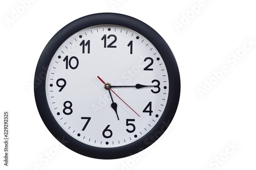 Time concept with black clock at a quarter past five am or pm