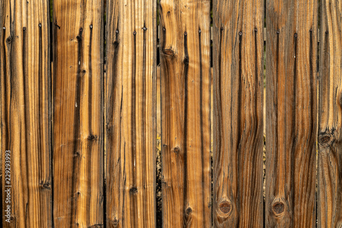Weathered brown wood background surface. Wooden wall texture rustic planks with nails.