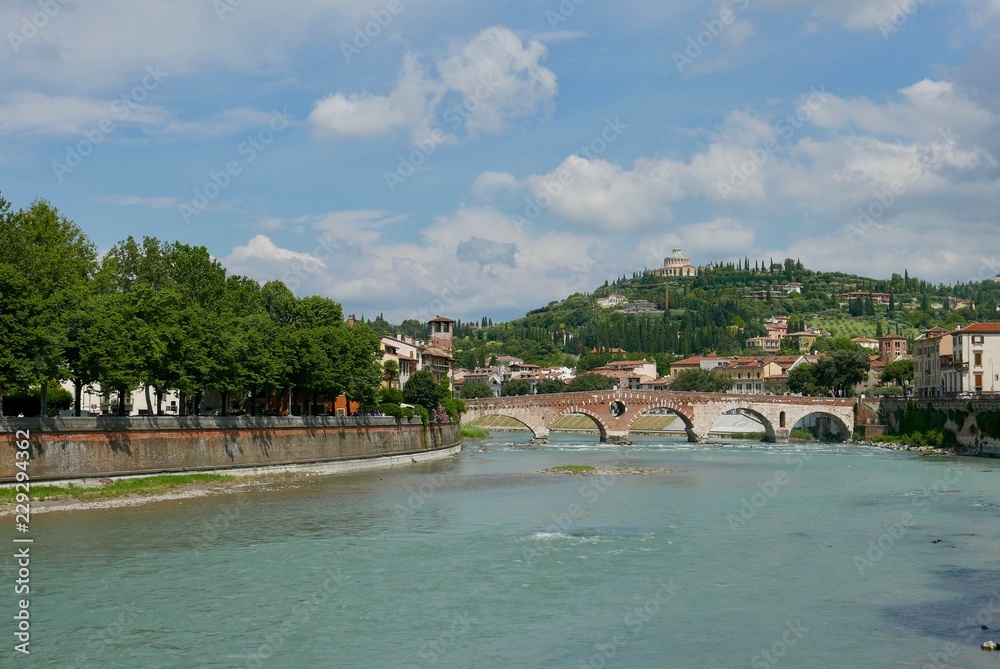 Old roman bridge across adige river Verona