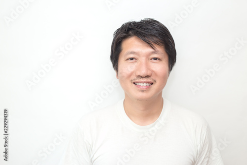 Obraz na plátně Attractive beautiful smiling positive asian happy man