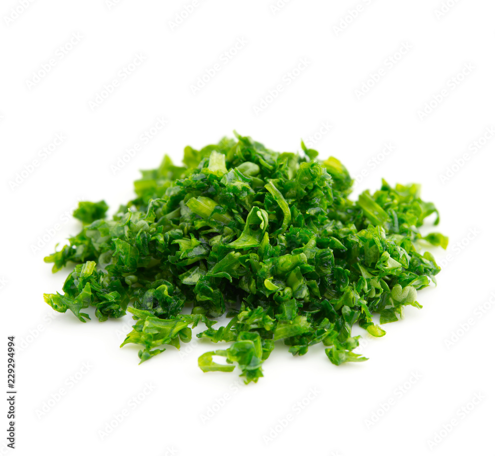 High magnification macro of a small mound of finely chopped parsley, isolated on white. High magnification macro of a small mound of finely chopped parsley, isolated on white.