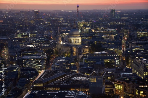The skyline of London, England at sunset, including St. Paul's Cathedral. 