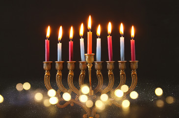 image of jewish holiday Hanukkah background with menorah (traditional candelabra) and candles.