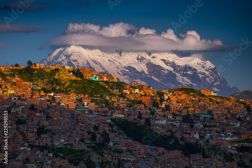 Snow caped mountain of Illimani and the city of La Paz at sunset, Bolivia