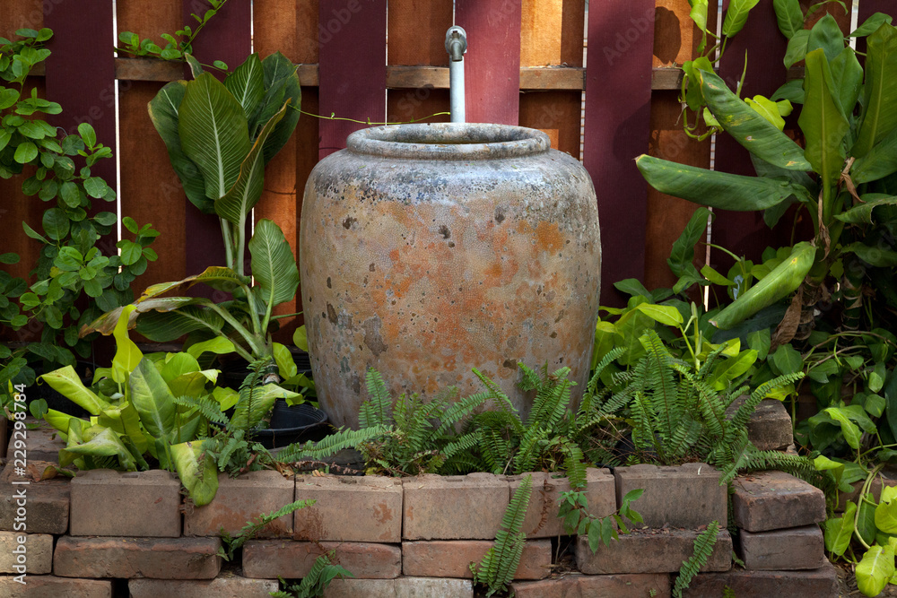 Obraz premium Garden design with jar.