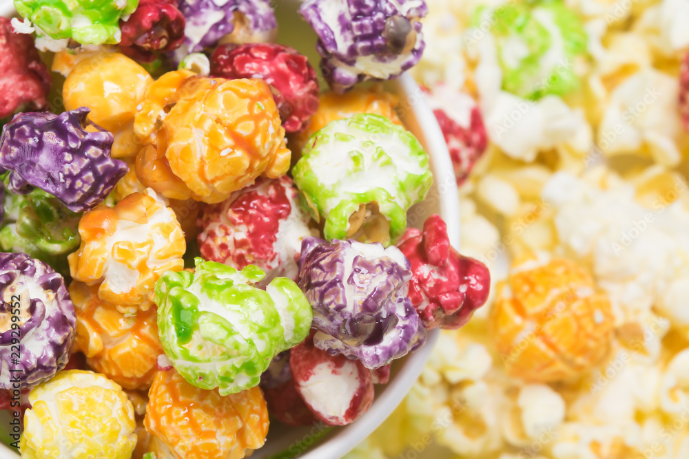 popcorn in colored caramel glaze, close-up background