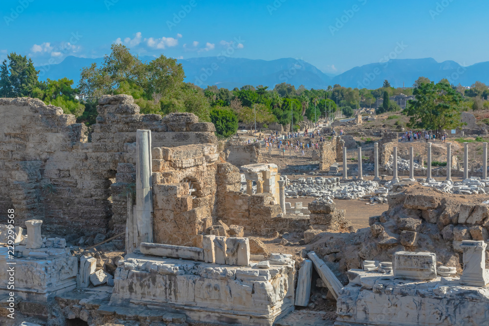The ruins of the ancient Roman city of Side in Turkey. The remains of buildings, theater and other infrastructure of the ancient city. Historical monuments of ancient Greek and Roman eras.