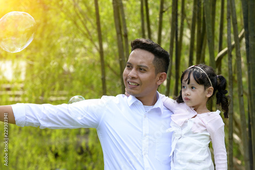 malay muslim father and child outdoor