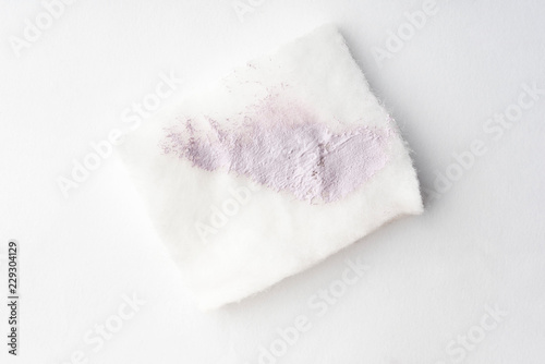 Brightening makeup base smudge on cotton pad