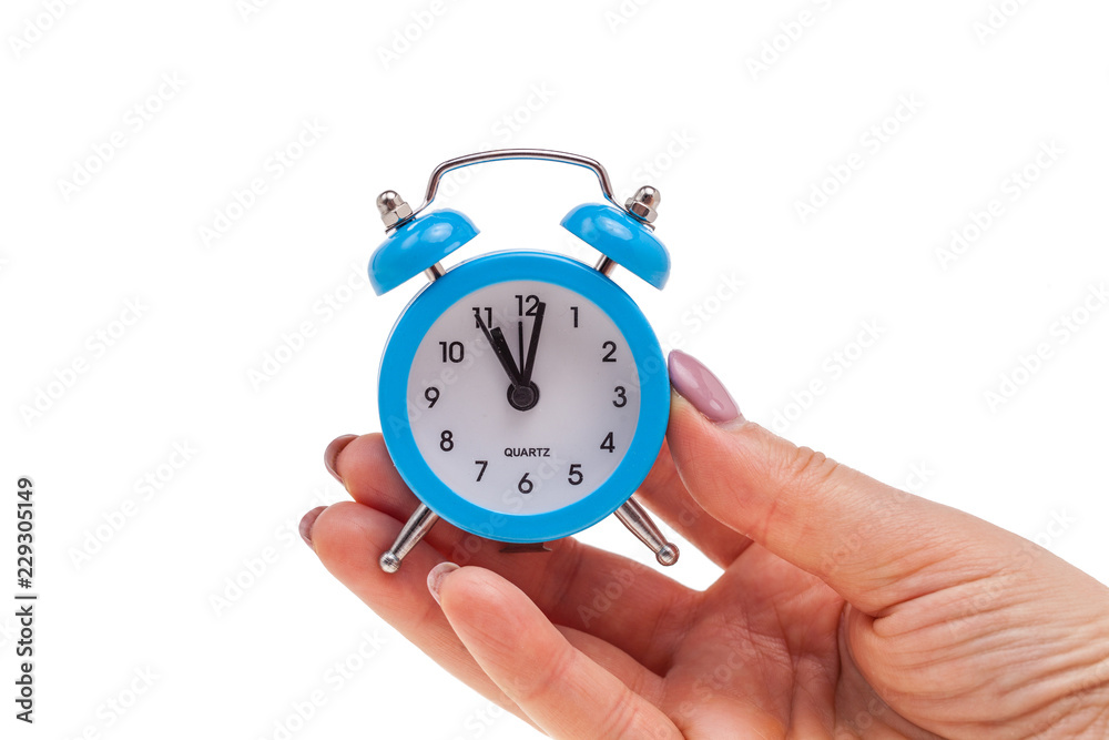small alarm clock in hand, concept of being in time small alarm clock in hand, concept of being in time
