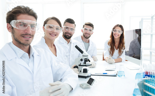 Male scientist and the team in the lab. © ASDF