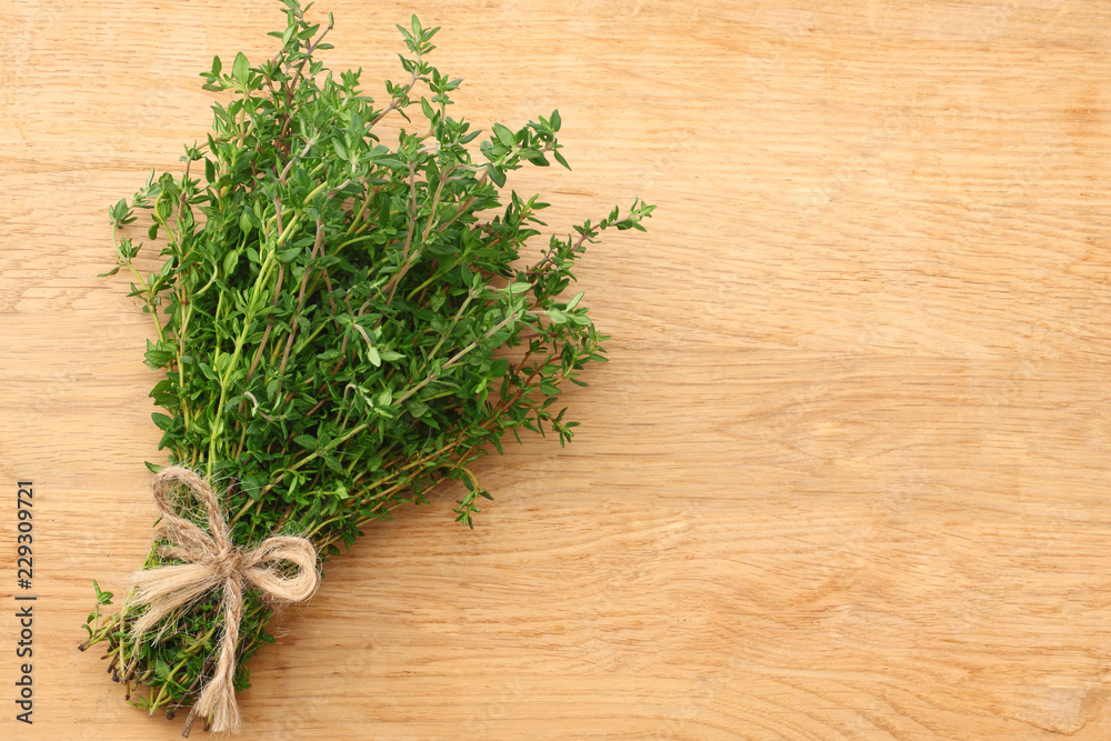 Thyme bunch on wooden background. top view Thyme bunch on wooden background. top view