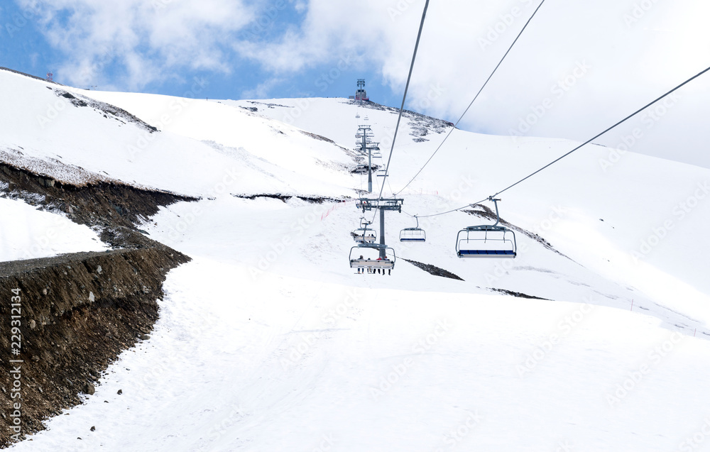 cable car in the Caucasus mountains in winter, the mountain slopes are covered with snow