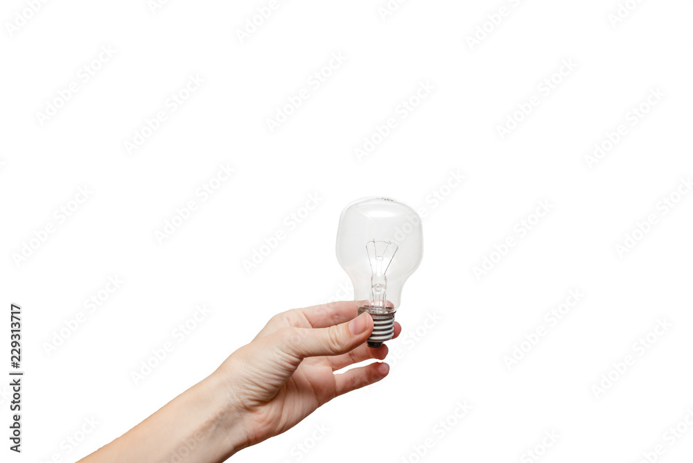 Female hands holding a light bulb. Idea and electicity Concept. European , white background, isolated Female hands holding a light bulb. Idea and electicity Concept. European , white background, isolated
