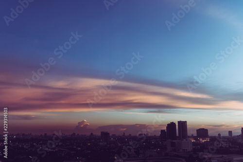 Colorful sky sunset over cityscape.