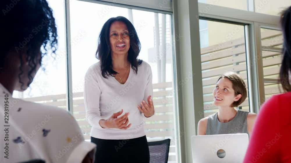 A meeting held in an office by a female boss, women only