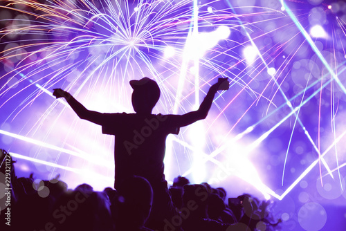 New Year concept, cheering crowd and fireworks