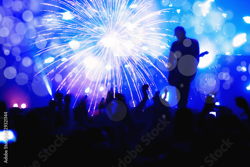New Year concept, cheering crowd and fireworks