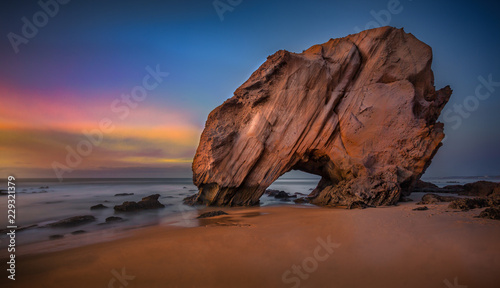 Penedo do Guincho. 143'' long exposure of this peculiar rock formation at sunset with low tide, located in the Santa Cruz beach, Portugal