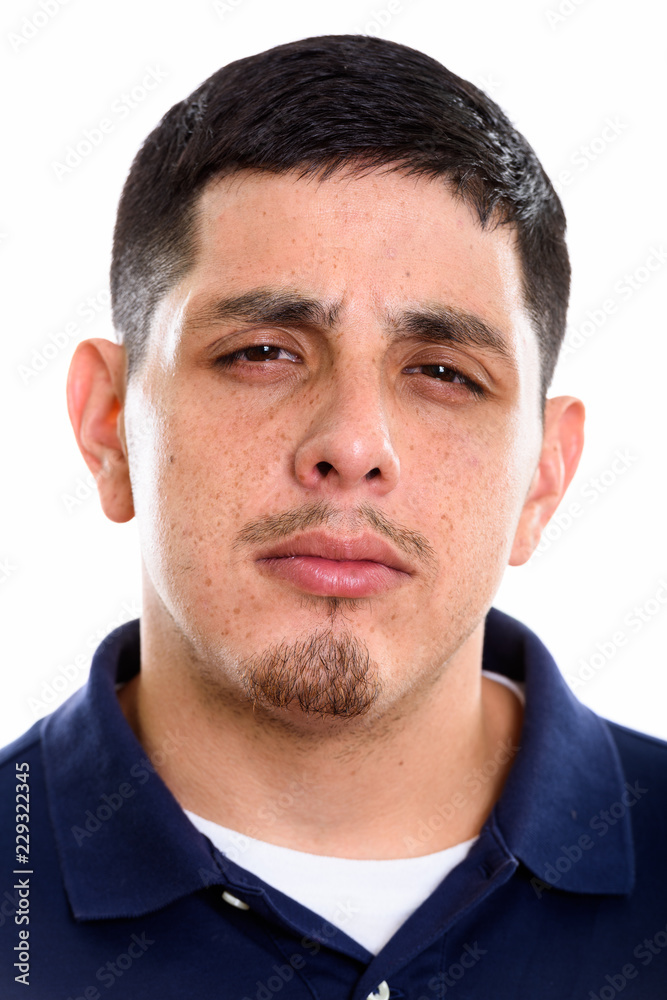 Face of young Hispanic man looking mad Face of young Hispanic man looking mad