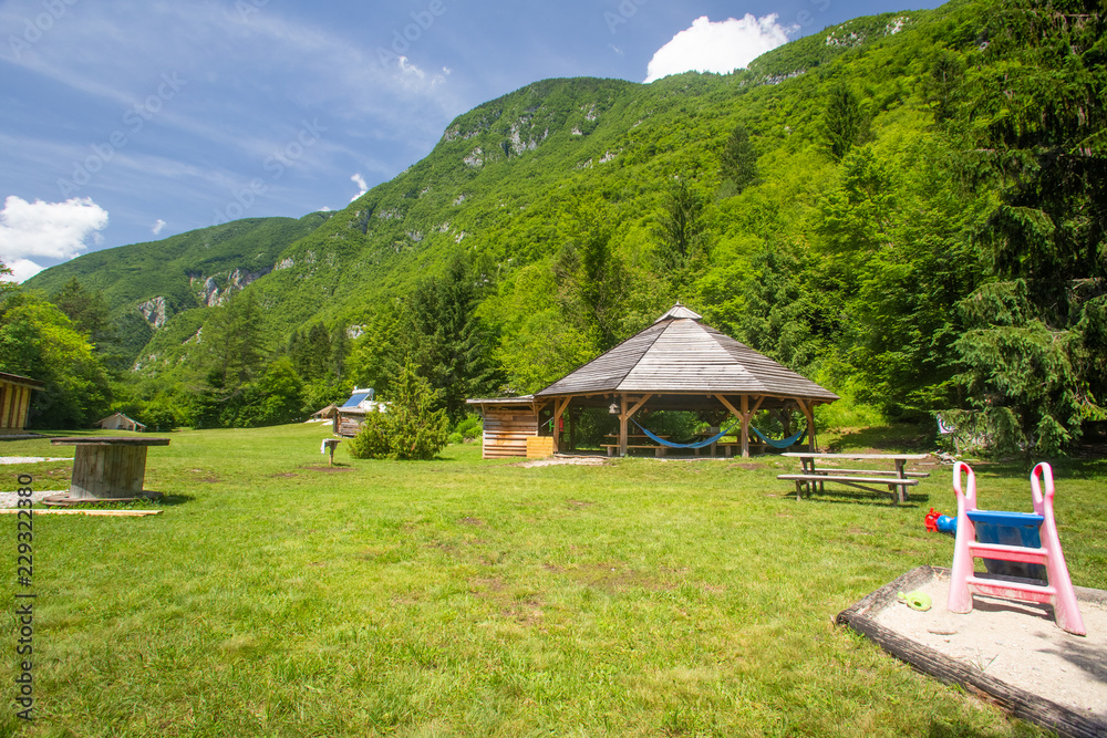 Gazebo and alpine environment in Adrenaline Check eco camp resort in Slovenia.