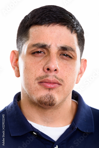 Face of young Hispanic man looking mad