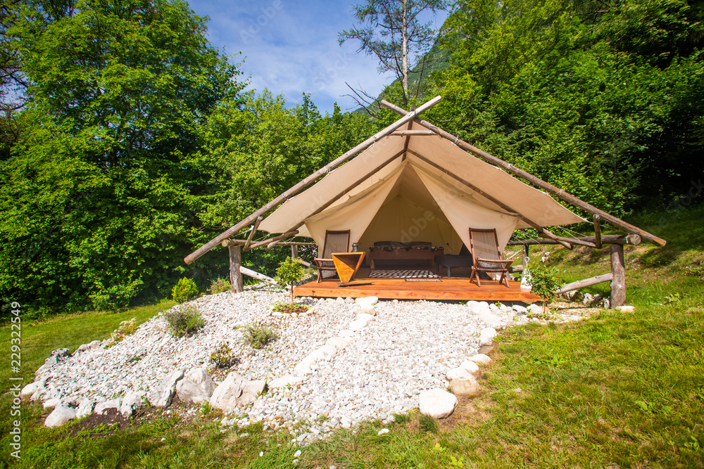 Glamping tent exterior in Adrenaline Check eco camp in Slovenia. Stock  Photo | Adobe Stock