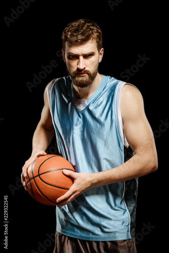 Basketball player posing with ball