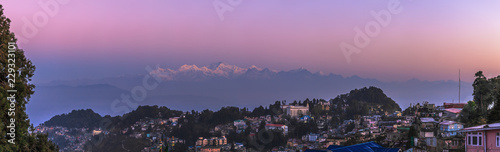View of a mountain ridge of Kanchendzhonga in the State of Sikkim, from the neighborhood of the city of Darjeeling, early in the morning, till the sunrise. photo