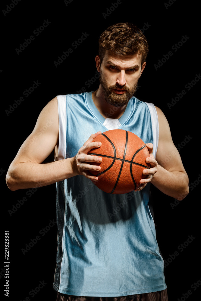 Athletic man playing basketball