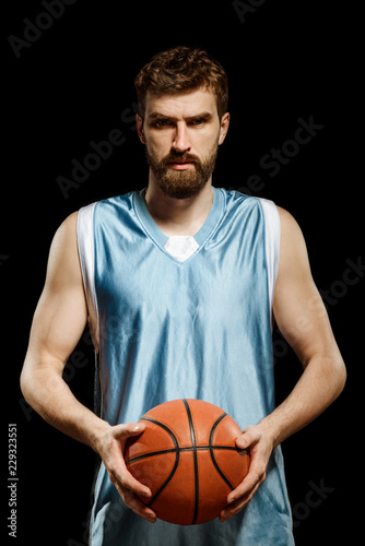 Portrait of sportsman holding ball