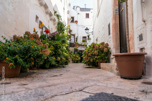 Little alley in the medieval center of the white village of Locorotondo