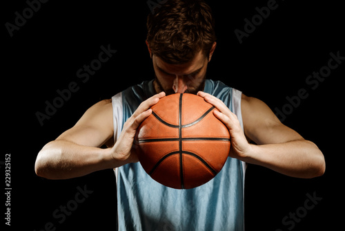 Focused man holding a basketball © yuriygolub