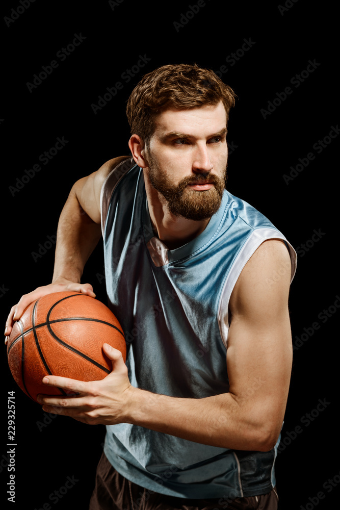 Confident basketball player on black Confident basketball player on black