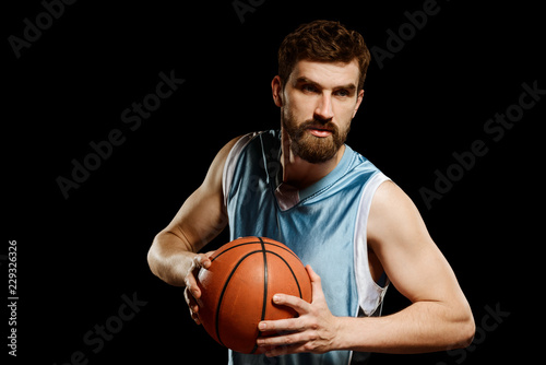Man posing with a basketball