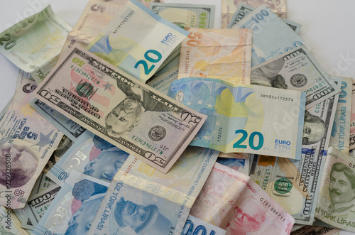 Dollar,liras and euro banknotes are on the table.