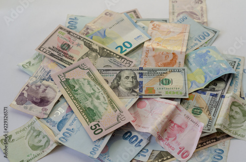 Dollar,liras and euro banknotes are  on the table.