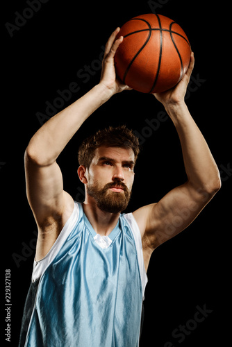 Isolated on black basketball player