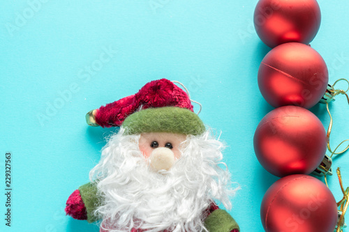 Santa Claus and red christmas balls