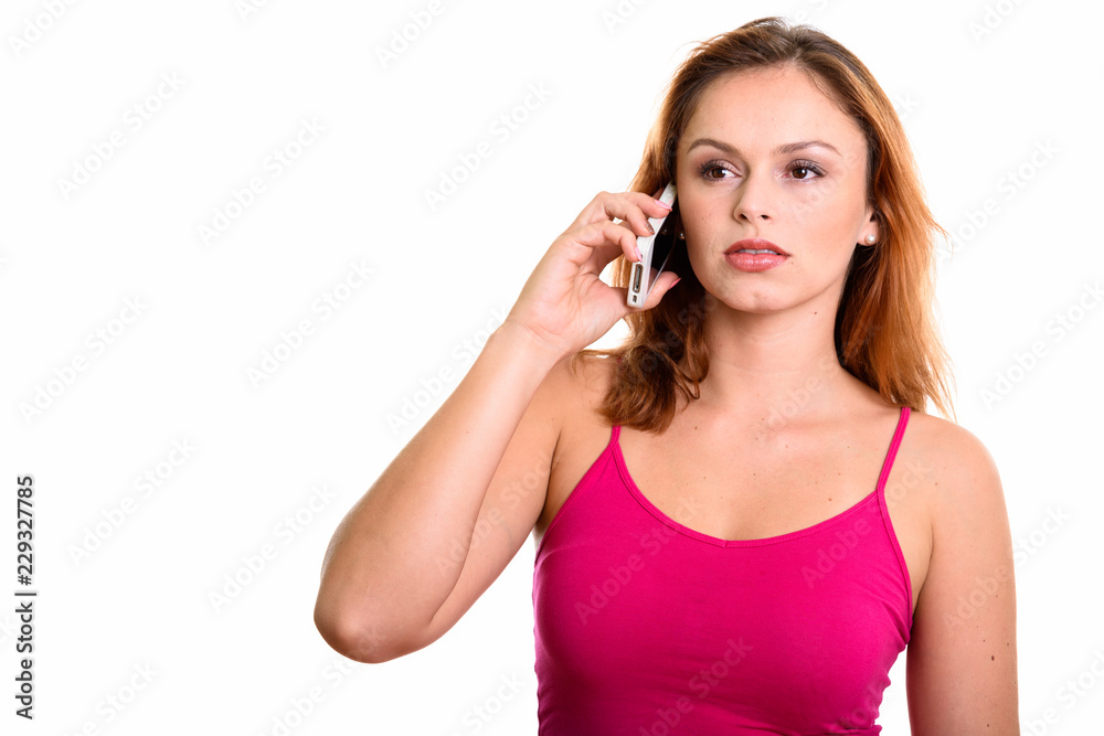 Young beautiful Brazilian woman talking on mobile phone while th Young beautiful Brazilian woman talking on mobile phone while th