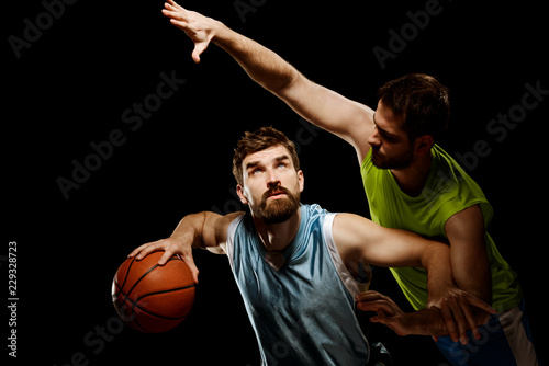 Basketball player struggles with opponent © yuriygolub