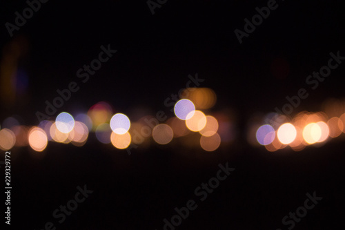 Colorful bokeh of the city in the midnight with blurred background © Victoruler