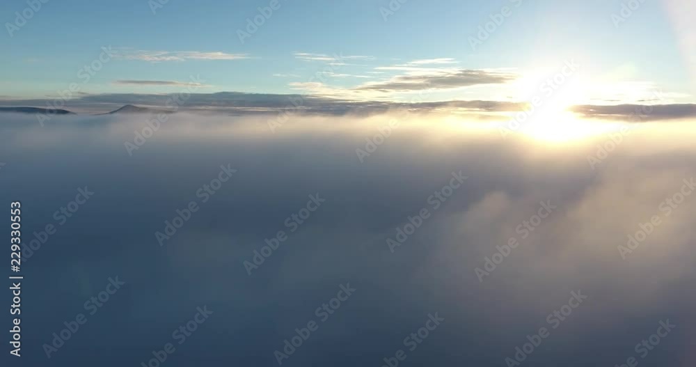 4K Drone aerial Sky over the clouds, sun