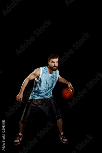 Basketball player handling a ball © yuriygolub