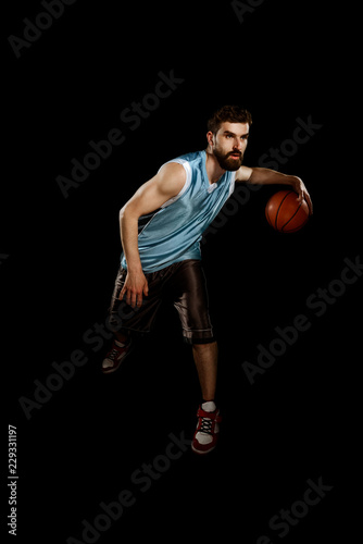 Muscular man dribbling a ball © yuriygolub