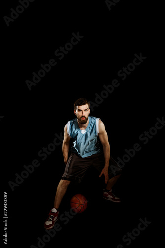 Basketball player dribbling a ball