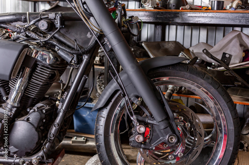 Wallpaper Mural Cropped close up shot of beautiful and custom made motorcycle in the workshop Torontodigital.ca