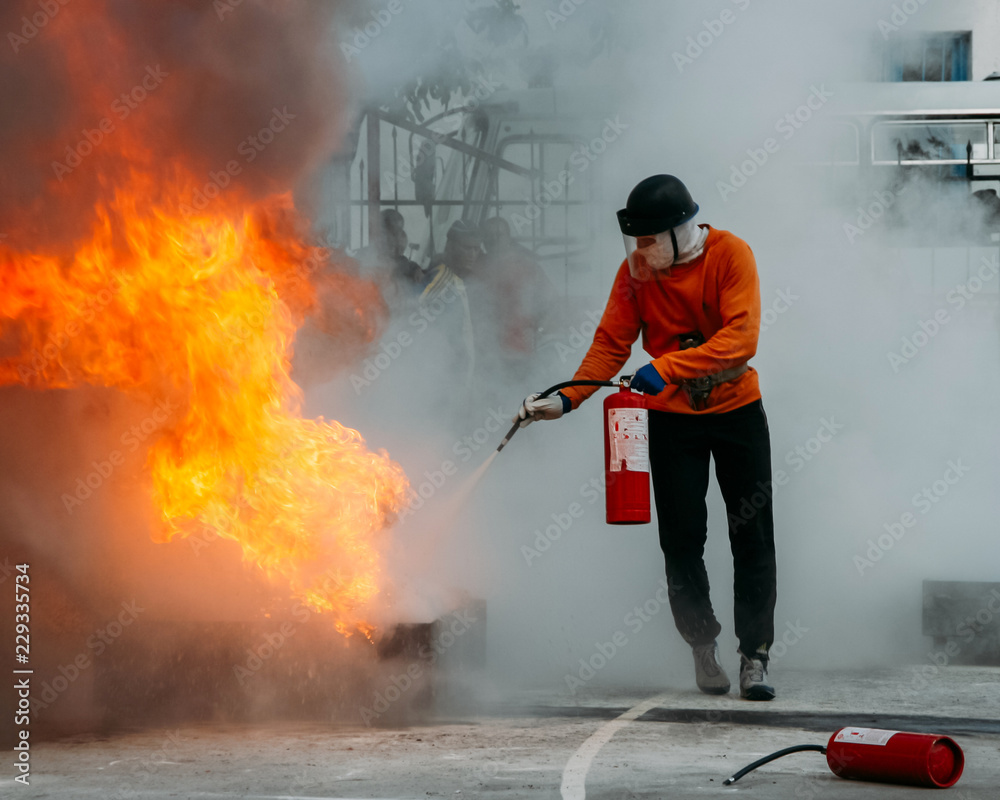 Naklejka premium Man with extinguisher