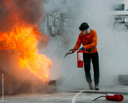 Man with extinguisher